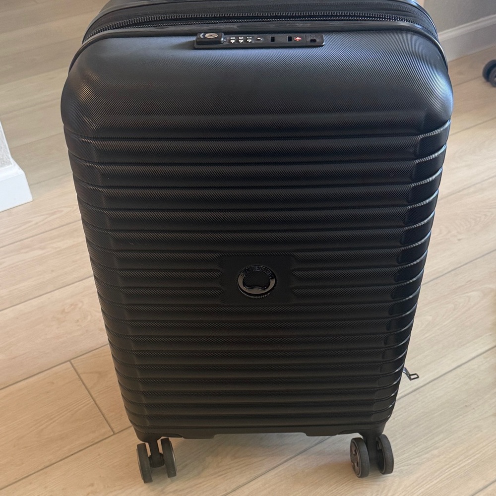 Black Carry-on DELSEY PARIS Hardshell Rolling Suitcase
